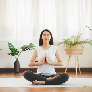 Woman meditating indoors — menopause support for mood swings, calm, and emotional balance.
